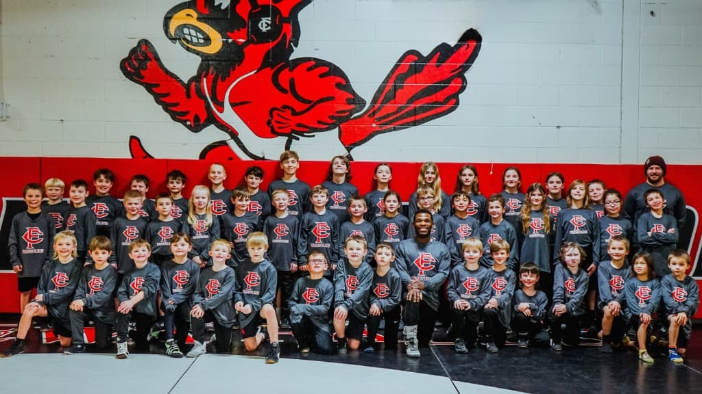 Youth wrestling team group photo representing sports organizations and community programs.